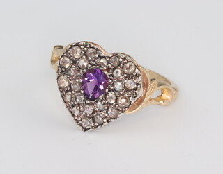 A Victorian style yellow metal diamond heart shaped ring, set with a pear shaped amethyst 0.25ct, the brilliant cut diamonds 0.6ct, size N 1/2, 3gms  