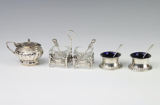 A Sterling silver cruet base, two salts, a mustard and four spoons, 116 gms
