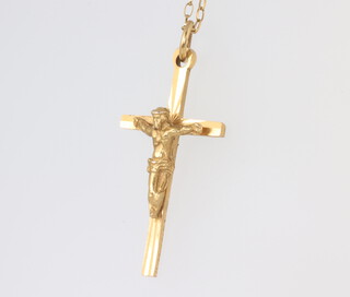 A 9ct yellow gold crucifix pendant and chain 2.5gms 