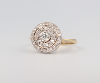 A yellow metal Edwardian style target diamond ring 0.5ct, size M, 3.6gms 