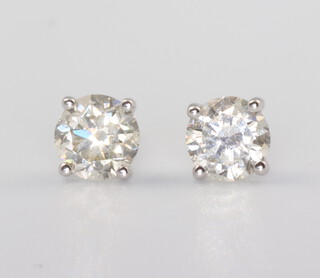 A pair of white metal stamped 18ct single stone diamond ear studs 1.2ct