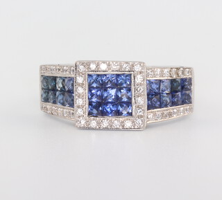 A white metal stamped 750 gentleman's sapphire and diamond ring, the princess cut sapphires 1.25ct, the brilliant cut diamonds 0.50ct, 10gms, size U 1/2