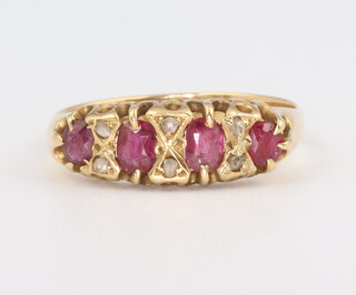 A yellow metal 18ct garnet and diamond chip ring, size N, 2.5gm 