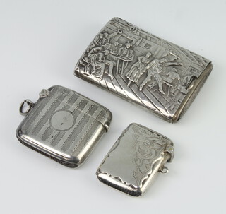 A white metal 830 repousee sleeve, depicting an inn scene, with white metal interior, two silver vestas