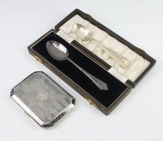 A silver octagonal cigarette case, London 1921, together with two silver spoons, gross weight 136gms