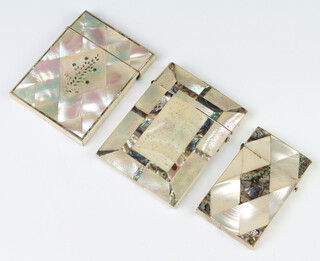 A Victorian mother of pearl inlaid card case (loose lid), a ditto decorated with flowers and a smaller ditto 
