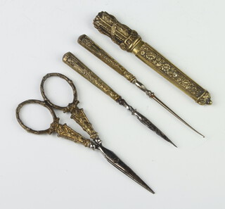 A 19th Century Continental gilt needle case, a pair of ditto scissors and 2 implements 