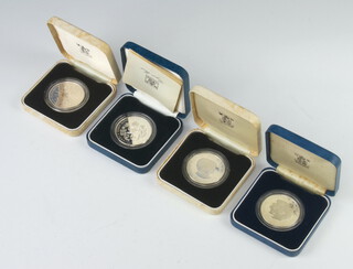 Four silver proof commemorative coins - His Royal Highness The Prince of Wales and Lady Diana Spencer 1981 Royal Wedding (x2), Queen Elizabeth The Queen Mother 1980 crown and a Queen Elizabeth The Queen Mother 80th Birthday crown, each 28gms  