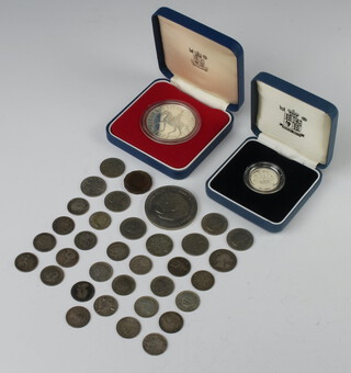 A 1977 silver commemorative crown, a silver proof one pound coin and minor coinage 