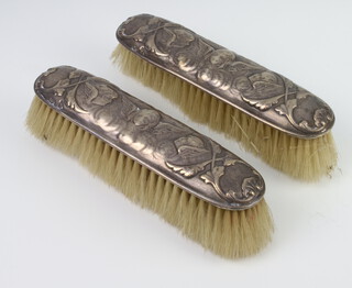 Two silver mounted Reynolds angels clothes brushes, rubbed marks