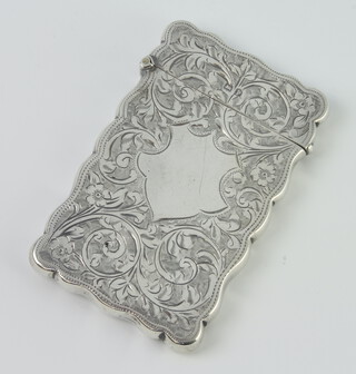 A silver cigarette case with engraved scrolling flowers and vacant cartouche Birmingham 1914, 54gms 