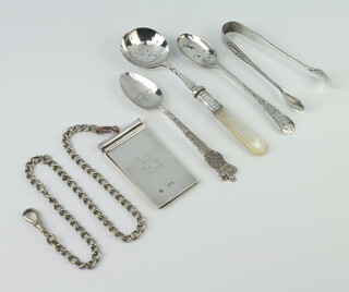 A Victorian silver aide memoire with engraved presentation inscription, London 1896, 7cm, suspended on a plated chain, together with a spoon, nips and 2 plated spoons 