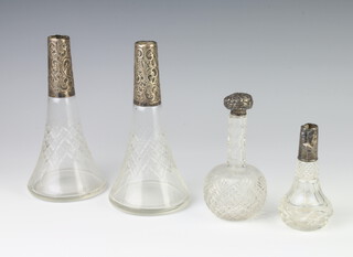 A cut glass bottle with a silver mounted collar (no stopper) London 1918, 17cm, 2 others (no stoppers) and a similar ditto with a stopper 
