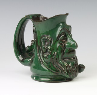 A Brannam Barum character jug with a pipe smoker, the handle in the form of a pigs head 14cm 