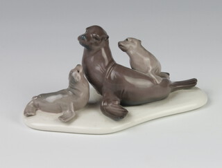 A Lladro group of a seal and pups 14cm 