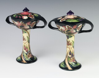 A pair of contemporary Moorcroft Marshmallow pots and stands with covers, twin handled, impressed marks and dated 2003, 21cm  