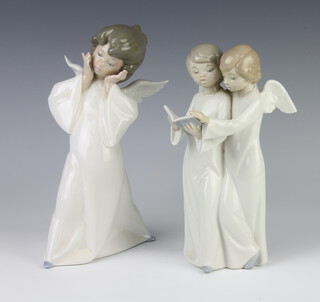 A Lladro figure of an angel 4959 20cm, a Nao group of 2 angels 19cm 
