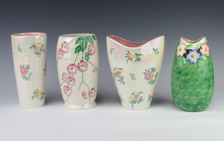 A Maling tapered vase decorated with flowers 22cm, ditto 20cm, an oviform ditto 23cm and a waisted ditto 24cm 
