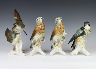 A Continental porcelain figure group of 2 birds 29cm and 3 others 
