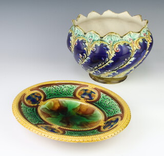 A Continental Majolica jardiniere with scroll decoration 19cm (cracked), ditto oval dish 32cm (chipped) 