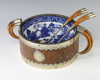 Taylor Tunnicliffe & Co, a Victorian blue and white Willow pattern salad bowl contained in a plated mounted faux tusk stand with presentation inscription and mounted servers 
