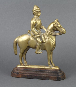 A 19th/20th Century brass and iron doorstop in form of a mounted cavalryman 25cm x 18cm x 6cm 