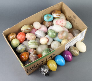 Fifty various turned hardstone eggs