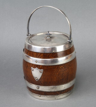 An Edwardian silver plated mounted oak biscuit barrel 