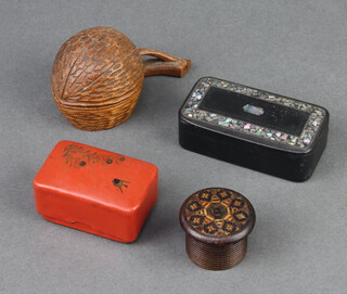 A Victorian Tunbridge Ware cylindrical jar and cover 2.5cm x 3.5cm, a carved hardwood inkwell in the form of a cherry (liner missing) 4cm x 4cm, a Victorian ebonised and inlaid mother of pearl trinket/snuff box 2cm x 7cm x 4cm and a Chinese red lacquered jar and cover 3cm x 5cm x 3cm 
