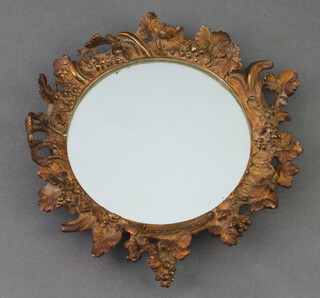 A 19th Century circular plate mirror contained in a gilt metal floral decorated frame 20cm 