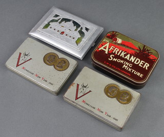 A Second World War pierced aluminium "POW" cigarette case 12cm x 8cm, 2 1945 South African Comfort Fund cigarette boxes dated '45 (some light rust and dents), and an Afrikander metal tobacco box 
