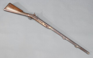 A 19th Century muzzle loading percussion fowling piece with 80cm barrel, walnut stock with chequer grip, ram rod and foresight are missing 