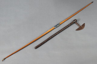 A 19th Century South African iron and hardwood war/battle axe, the iron head 14cm x 19cm, the hardwood shaft 73cm together with a yew and horn mounted bow marked 22 164cm 