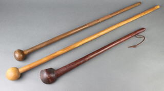 Three various African carved hardwood knobkerrie 64cm, 82cm and 98cm 