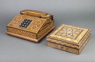 An inlaid Moorish style push button telephone 10cm x 23cm x 22cm together with an inlaid mother of pearl trinket box 6cm x 19cm x 19cm