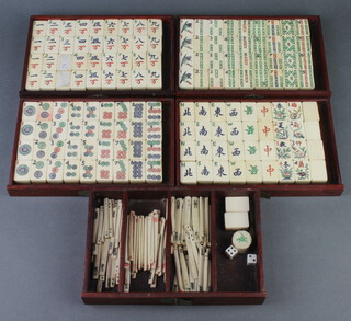 A 144 piece bamboo and bone mahjong set and 2 blanks, together with markers contained in 5 shallow trays 