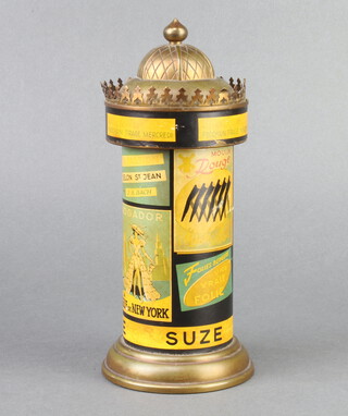 A French novelty cigarette dispenser in the form of a cylindrical hoarding decorated with adverts for Cabaret Mogador Moulin Rouge Suze 22cm h x 10cm diam. 