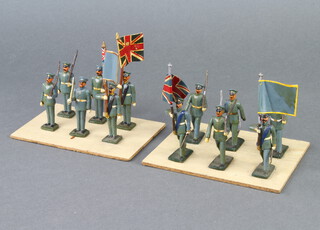 Twelve various lead soldiers - 2 officers, 4 ensigns and 6 guardsmen 