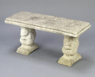 A rectangular well weathered concrete garden bench supported 2 squirrels 41cm h x 69cm w x 36cm d  