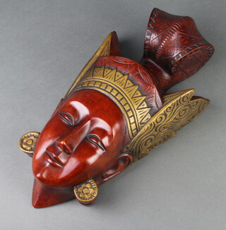 An Achatit carved mask of a Masai lady 39cm x 23cm, the reverse labelled and marked 6100H 