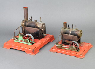 A Mamod stationary steam engine complete with burner raised on a square base 14cm  x 21cm x 18cm and 1 other 19cm x 23cm x 25cm 