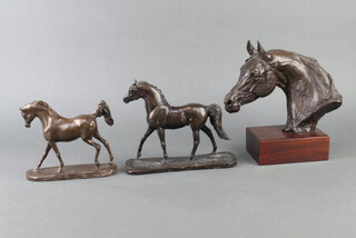 After P McKuen, a limited edition bronzed figure "The Arab Mares Head" no.14 of 200, raised on a mahogany case 21cm h x 13cm w x 9.5cm, together with 2 bronzed figures of walking Arab horses 15cm x 19cm x 6cm and 12cm x 5cm x 15cm 