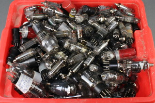 A collection of BVA Mazda and other valves contained in a red plastic crate 