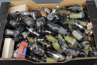 A collection of military and other valves contained in a fruit box 
