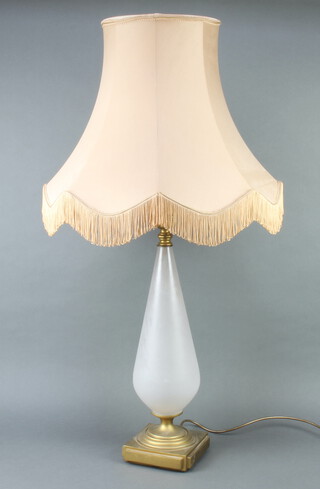 A gilt metal and opaque glass table lamp raised on a square base 61cm h x 16cm w x 16cm d 