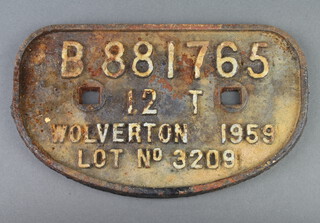 A cast iron railway wagon plate marked B881765 12T Wolverhampton 1959, lot no. 3209 16cm x 27cm 