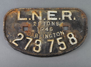 A cast iron railway wagon plate marked L.N.E.R. 21 Tons 1946 Darlington 273758 16cm x 27cm 
