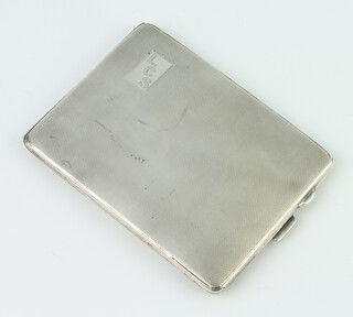 A silver engine turned cigarette case with monogram, gross weight 146gms, Birmingham 1943, 11cm 