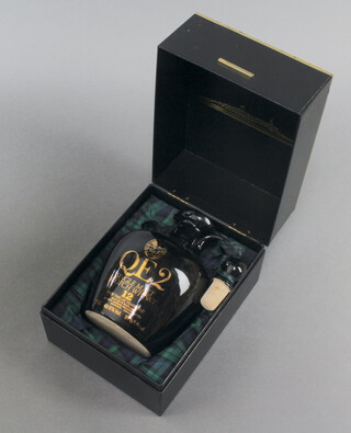 A 75cl flagon of QE2 commemorative 12 year old single malt whisky, boxed (there appears to be considerable spirit loss) 