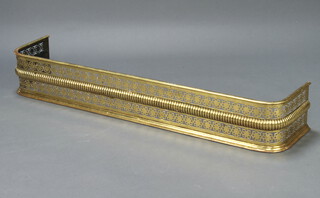 A Victorian pierced brass fender 22cm h x 142cm w x 28cm d 